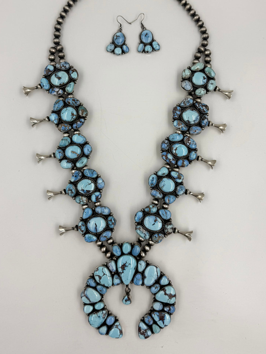Sky blue and lavender colored turquoise  squash blossom necklace 