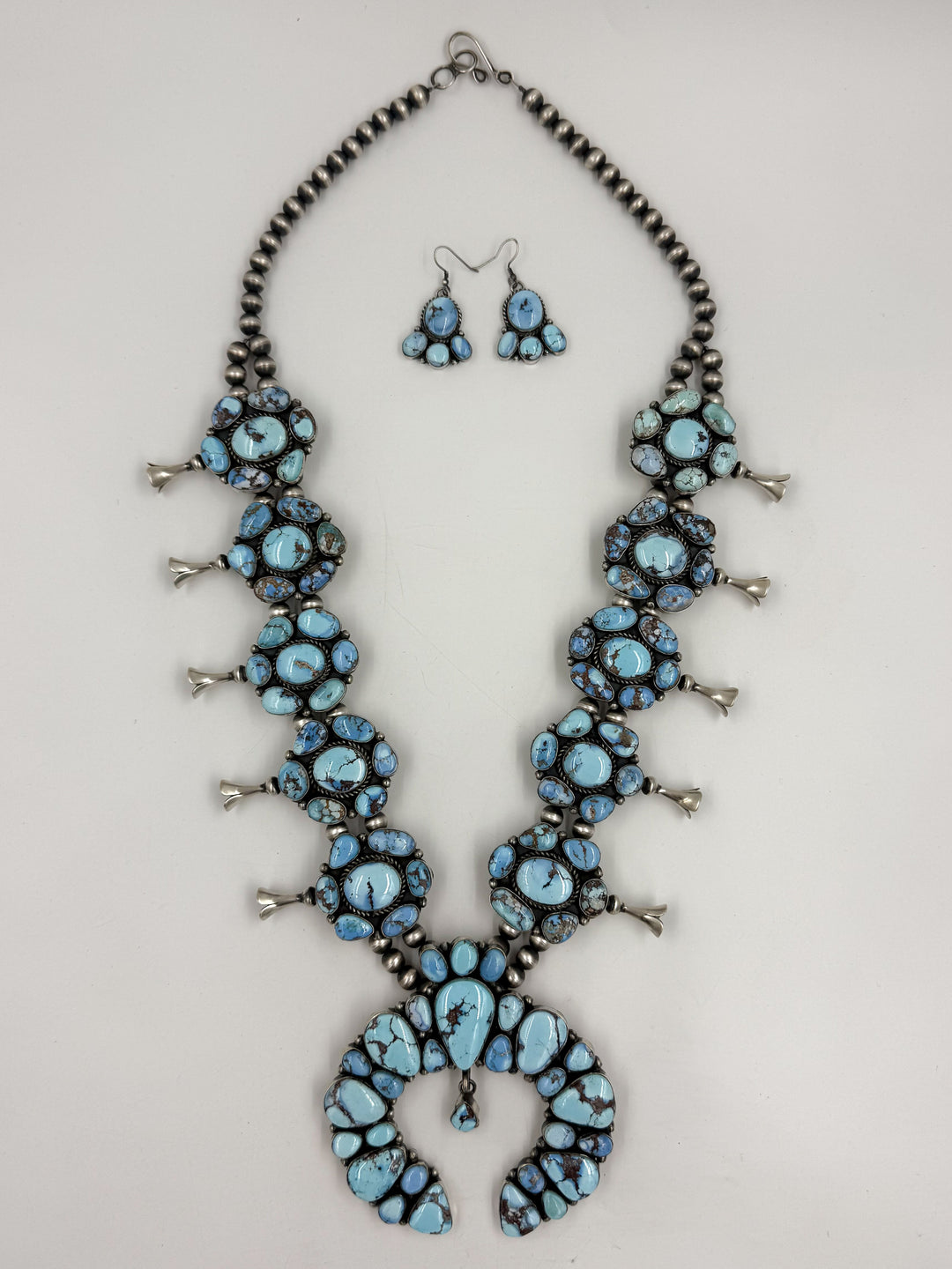 Sky blue and lavender colored turquoise  squash blossom necklace 