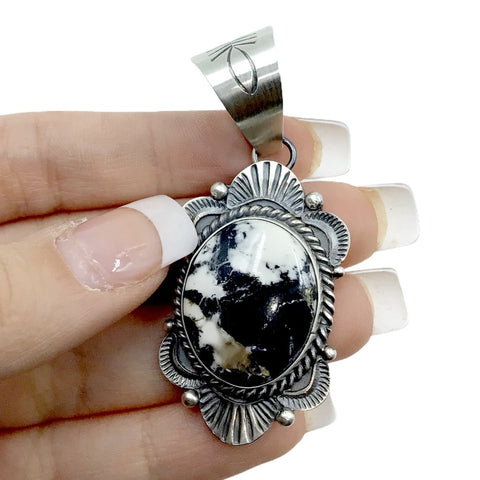 Image of Native American Pendants - Navajo White Buffalo Dark Oval Stone Old-Style Stamped Sterling Silver Pendant - Mary Ann Spencer - Native American